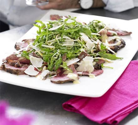 Unusual beef & anchovy salad with rocket & Caesar dressing