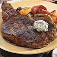Rib-Eye Steaks with Bell Peppers and Gorgonzola Butter